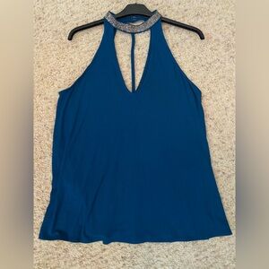Teal Express top with gun metal small beads around the neck. V front and back.